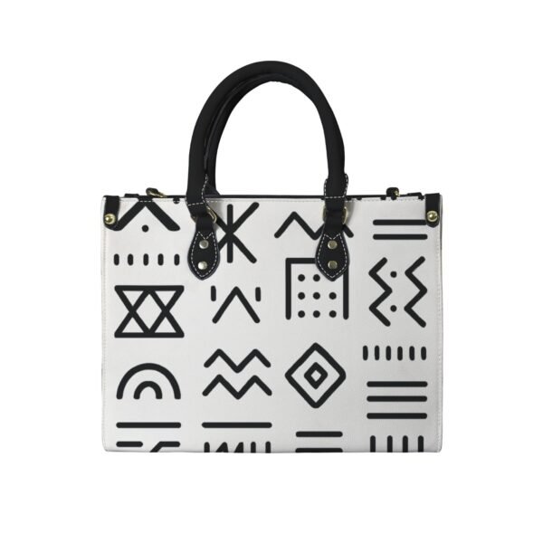 Grand sac à main blanc Maïa Muto Odyssée Magistrale avec motifs graphiques noirs denses et anses noires.